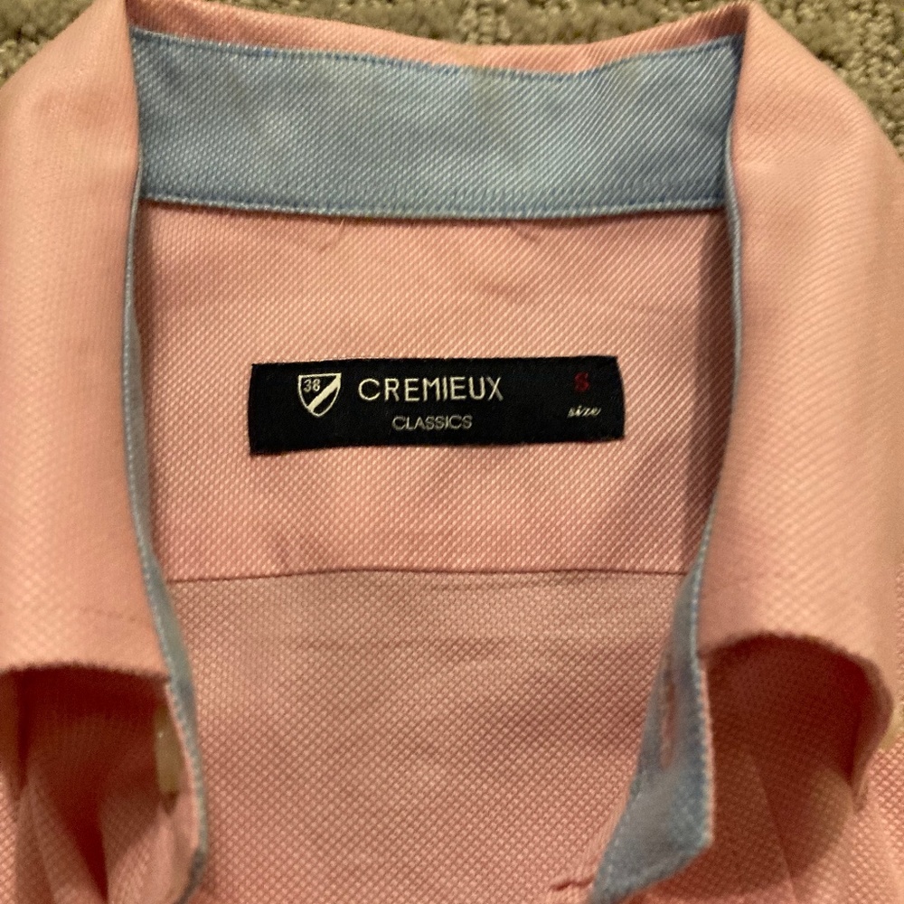 Pink button down with light blue cuffs.